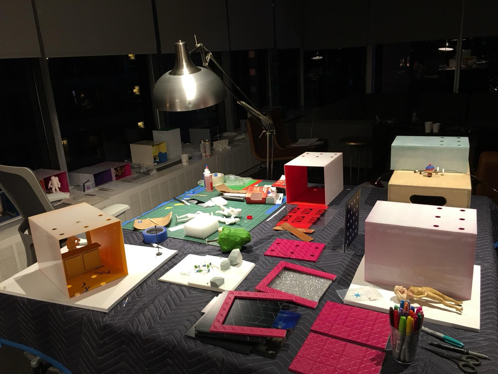 Cardboard maquettes on a desk
